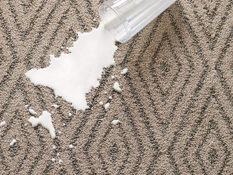 Milk spilled on patterned carpet - Free carpet cleaning services from Triangle Flooring Center in Carrboro, North Carolina